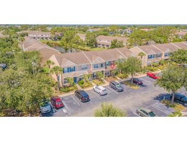 Inviting townhomes boast well-maintained landscaping and convenient parking at 6229 Bayside Key Dr, Tampa, FL 33615