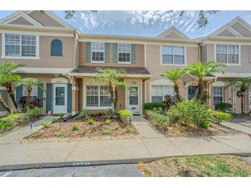 Charming townhome exterior with landscaped walkway and inviting entrance at 6229 Bayside Key Dr, Tampa, FL 33615