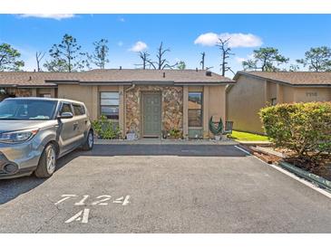 Charming single-story home with stone accents, convenient parking and well maintained landscaping at 7124 Barclay Ave # A, Spring Hill, FL 34609