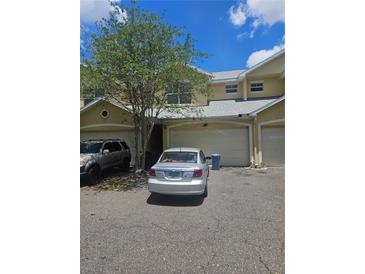 Townhouse featuring an attached garage and neutral stucco exterior, offering convenient parking and curb appeal at 7187 53Rd N St, Pinellas Park, FL 33781