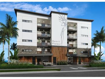 Modern condo building with balconies, stone accents, wood details and lush landscaping at 14048 Gulf Blvd # 302, Madeira Beach, FL 33708