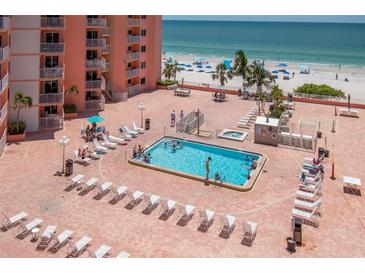 Aerial view of the outdoor pool and lounge area with stunning views of the ocean at 18400 Gulf Blvd # 2505, Indian Shores, FL 33785