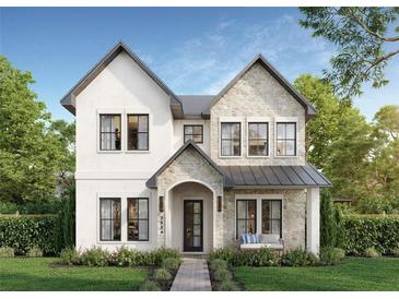 Charming two-story home featuring a stone and stucco facade, arched entryway, bench seating and beautifully landscaped front yard at 2534 2Nd S Ave, St Petersburg, FL 33712