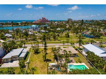 Charming home in a coastal community with a pool, lush landscaping, and close proximity to the beach at 3111 S De Bazan Ave, St Pete Beach, FL 33706