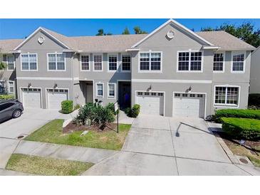 Charming two-story townhouse with attached garages, well-maintained landscaping, and a welcoming entrance at 608 Black Lion Ne Dr, St Petersburg, FL 33716