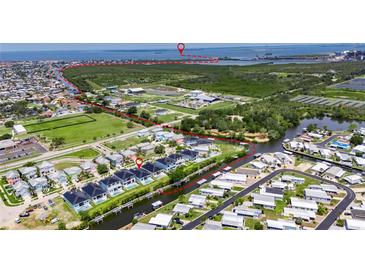 Waterfront homes with private pools and boat docks in a coastal community with easy access to the Gulf at 6534 Simone Shores Cir, Apollo Beach, FL 33572