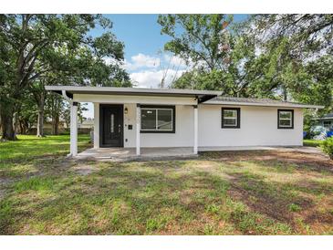 Charming one-story home featuring a freshly painted exterior and a welcoming front porch at 2220 3Rd E Ave, Bradenton, FL 34208