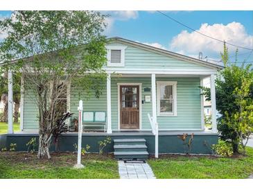 Charming single-story home featuring a covered front porch and well-maintained landscaping at 2320 E 12Th Ave, Tampa, FL 33605
