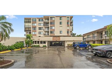 Multi-story condo building featuring private balconies, covered parking, and well maintained landscaping at 6269 Palma Del Mar S Blvd # 306, St Petersburg, FL 33715