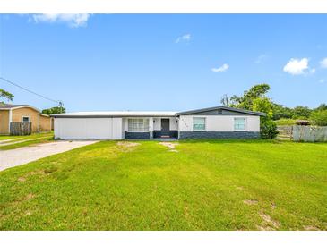 Charming single-story home featuring a well-maintained lawn and a freshly painted exterior at 5109 Horton Rd, Plant City, FL 33567