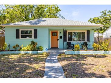 Charming single-story home with a walkway leading to the front door and an ADT security system sign on the lawn at 4531 7Th N Ave, St Petersburg, FL 33713