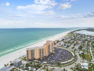 Breathtaking aerial view of the beachfront condo complex with stunning ocean views and manicured grounds at 880 Mandalay Ave # N607, Clearwater Beach, FL 33767