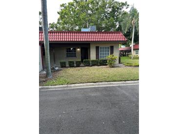 Charming single-story home featuring a red tile roof and well-maintained landscaping at 601 N Hercules Ave # 1008, Clearwater, FL 33765
