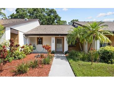 Charming single story home with a landscaped front yard and covered entryway at 7633 Piping Rock Ct # 7633, New Port Richey, FL 34654