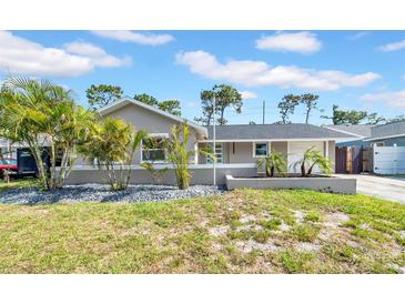 Charming single-story home with manicured landscaping and a freshly painted exterior at 8433 101St Ave, Seminole, FL 33777