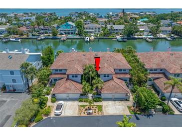 Beautiful waterfront condos with private boat docks in a lush, tropical setting at 903 Pinellas Bayway S # 103, Tierra Verde, FL 33715