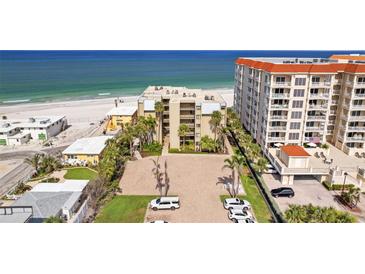 Stunning beachfront condo complex with manicured landscaping and ample parking, offering direct access to the beach at 17710 Gulf Blvd # 304, Redington Shores, FL 33708