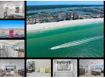 Stunning aerial view of the beach with emerald water and the city skyline in the background at 17920 Gulf Blvd # 1901, Redington Shores, FL 33708