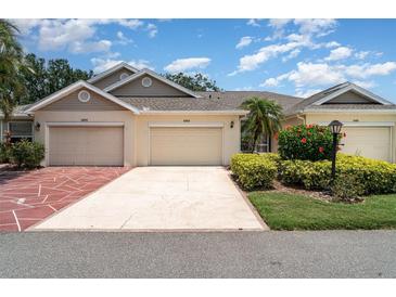 Charming villa with two car garage, mature landscaping, and inviting curb appeal at 2403 Nantucket Field Way # 27, Sun City Center, FL 33573