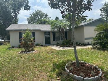 Charming single story home with mature trees and a well-maintained front yard at 116 Cranbrooke Dr, Seffner, FL 33584