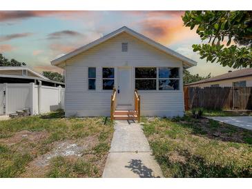 Charming white home featuring a minimalist design and cozy front entrance at 2627 17Th N Ave, St Petersburg, FL 33713