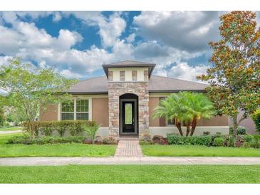 Charming single-story home with stone accents and lush landscaping at 2280 Long Spur, Odessa, FL 33556