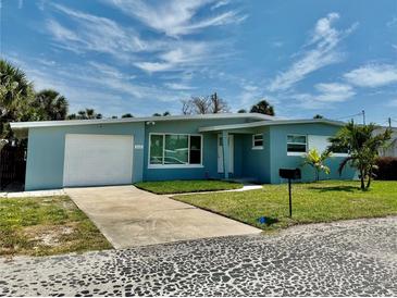Charming single-story home with a well-maintained lawn, attached garage, and a clean, modern facade at 440 89Th Ave, St Pete Beach, FL 33706