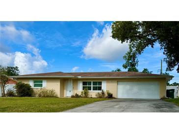 Charming single-story home with well-maintained lawn and a lovely, classic curb appeal in a quiet neighborhood at 1462 Highfield Dr, Clearwater, FL 33764