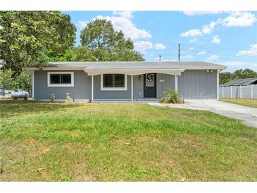 Charming single-story home featuring a well-kept lawn and inviting entrance at 1569 Larkin Rd, Spring Hill, FL 34608
