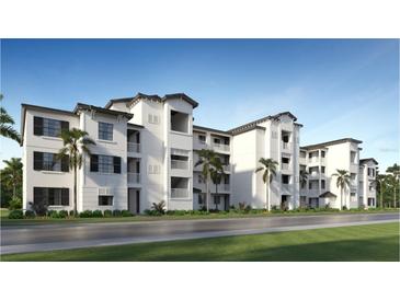 Elegant three-story condo building featuring white stucco facade, dark shutters, and private balconies offering a modern living experience at 19014 Scallop Loop # 105, Lakewood Ranch, FL 34202