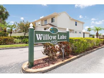 Inviting Willow Lake condo complex sign with manicured landscaping and clear community address at 6400 46Th N Ave # 203, Kenneth City, FL 33709