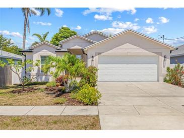 Charming single-story home with a two-car garage and a well-manicured lawn, showcasing curb appeal at 6741 51St N Way, Pinellas Park, FL 33781