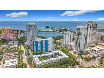 Scenic aerial view of downtown buildings near the waterfront with clear skies and blue ocean water at 105 4Th Ne Ave # 426, St Petersburg, FL 33701