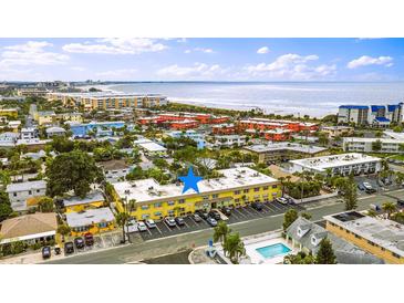 Bright and airy aerial view showcasing the proximity of the apartment to the beautiful beach at 600 71St Ave # 16, St Pete Beach, FL 33706