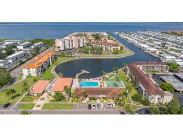 Waterfront condo community with a pool, tennis courts, and a boat dock with direct access to the bay at 19029 Us Highway 19 N # 5-14, Clearwater, FL 33764