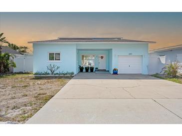 Charming, light blue, single-story home with a well-kept lawn and a welcoming front entrance at 2010 20Th Avenue Pkwy, Indian Rocks Beach, FL 33785