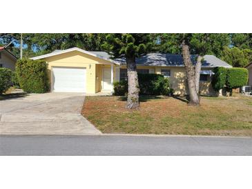 Charming single-story home with well-maintained lawn and landscaping at 9805 110Th Ln, Seminole, FL 33772