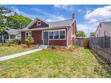 Charming single-Gathering home featuring a well-maintained lawn and a brick chimney at 2723 8Th N Ave, St Petersburg, FL 33713