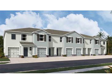 Charming townhome with a well-maintained lawn and an attached one car garage at 3510 Marigold Patch Ct, Plant City, FL 33565