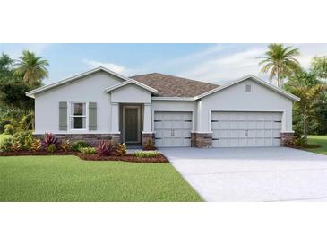 Charming single-Gathering home with a stone accent, neutral colors, and an attached two-car garage at 4026 Harvest Hearth Pl, Plant City, FL 33565