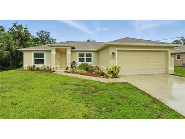 Charming single-story home with a well-manicured lawn and inviting front entrance at 5153 Bayley St, North Port, FL 34288