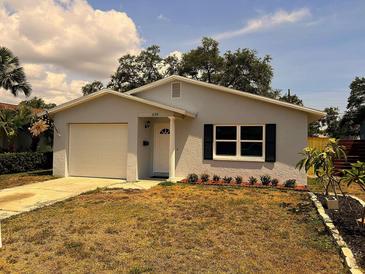 Charming single-story home with a well-maintained lawn and a one-car garage at 639 48Th N Ave, St Petersburg, FL 33703