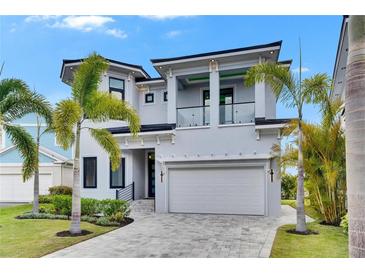Contemporary two-story home featuring a clean, modern design and a spacious two-car garage at 6526 Simone Shores Cir, Apollo Beach, FL 33572