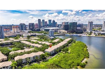 Beautiful aerial view of waterfront condo community near downtown Tampa and bay with lush landscaping at 746 Coral Reef Dr # 746, Tampa, FL 33602