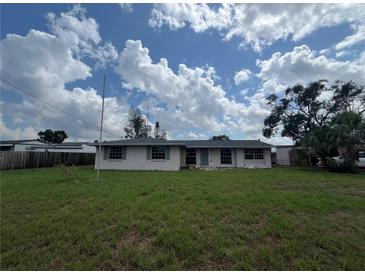 A charming single-story home with a large lawn, perfect for outdoor activities and enjoying the Florida sunshine at 802 White Heron Blvd, Ruskin, FL 33570