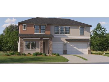 Charming two-story home with stone accents and a three-car garage at 11515 E 69Th Pl, Palmetto, FL 34221