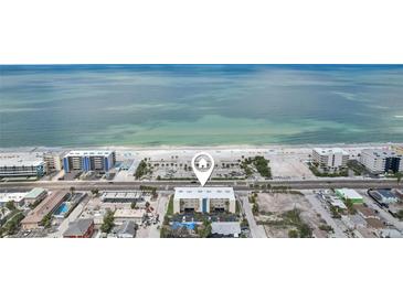Expansive aerial view of the beach condo showcasing its stunning beachfront location at 14401 Gulf Blvd # 106, Madeira Beach, FL 33708