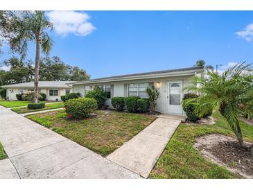 Charming single-story condo with well-manicured landscaping and a welcoming entrance at 301 Andover S Pl # 175, Sun City Center, FL 33573