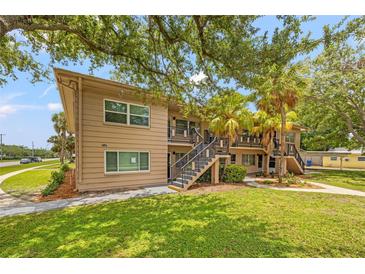 Two-story multi-Gathering building with manicured landscaping and a welcoming staircase to the units at 232 36Th N Ave # 202C, St Petersburg, FL 33704