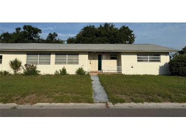 Charming single-story home with a quaint front porch and well-manicured lawn at 5600 9Th N Ave, St Petersburg, FL 33710